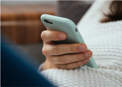 Woman with Phone Shopping Online