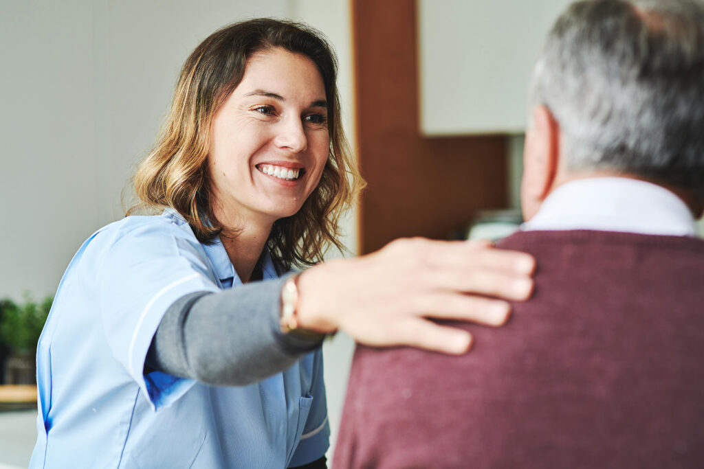 Smiling Nurse with Elderly Patient