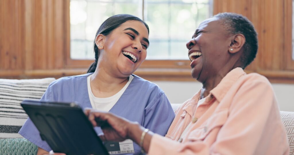 Happy,Woman,,Doctor,And,Tablet,In,Elderly,Care,Or,Laughing