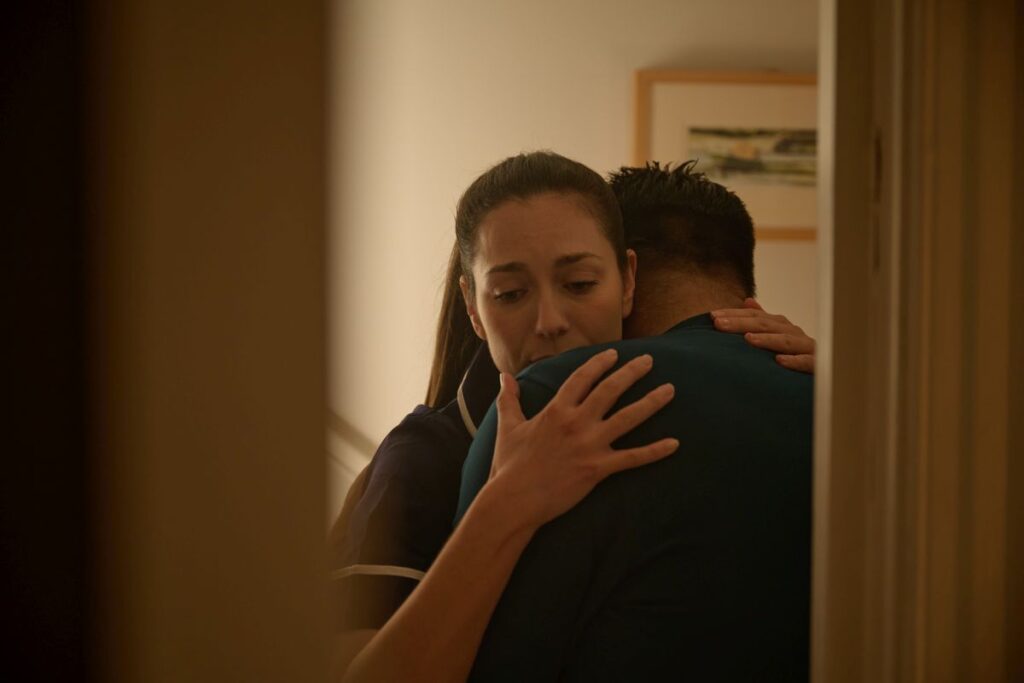 This Is Hospice Care Nurse Consoling Family