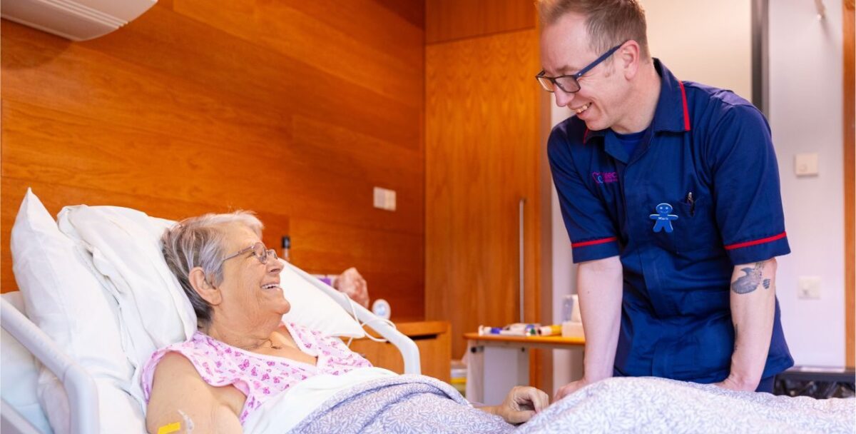 Male nurse with elderly female patient