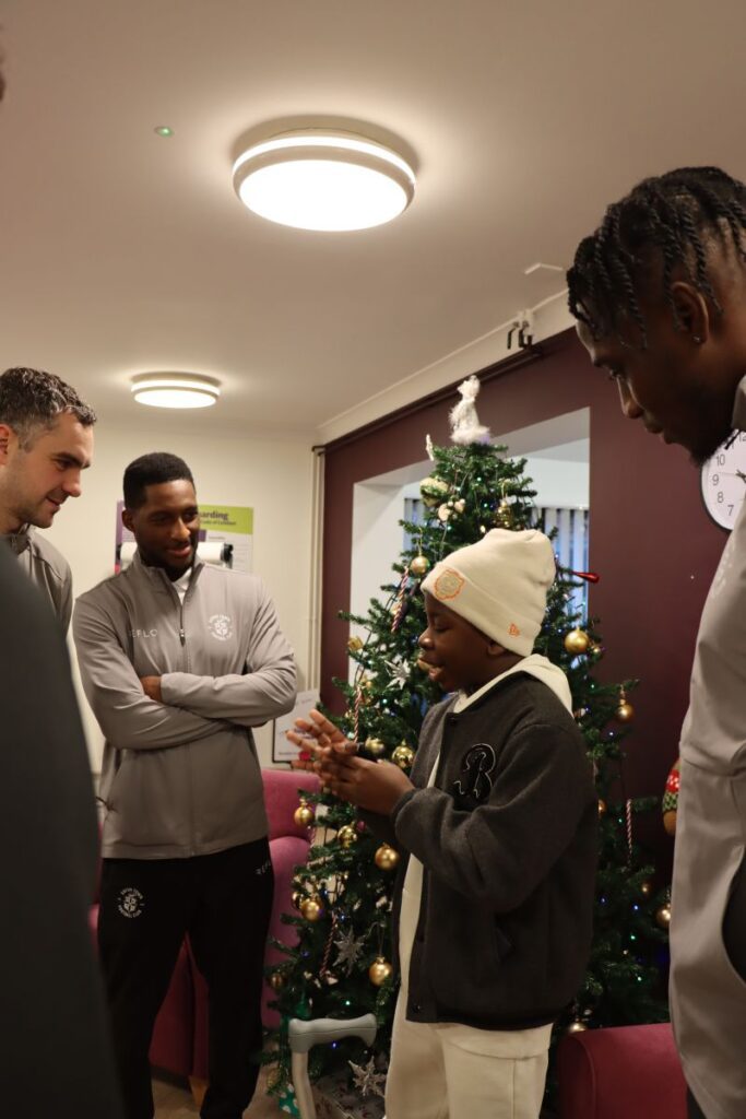 Hatters with Child Patient at Keech Hospice