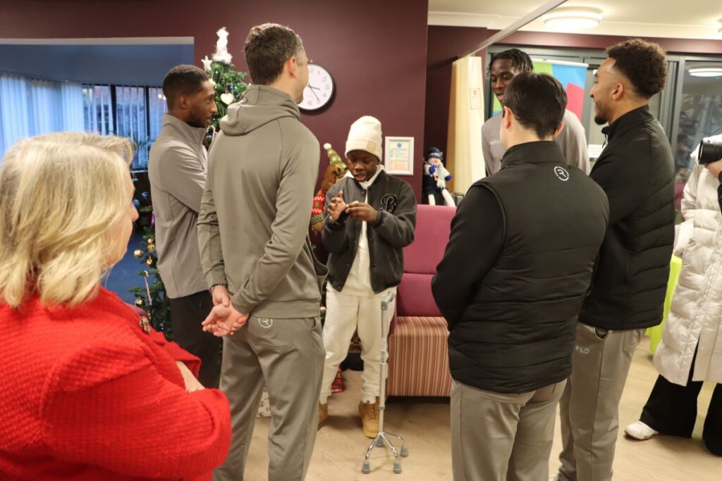 Hatters with Child Patient Giving Speech at Keech Hospice
