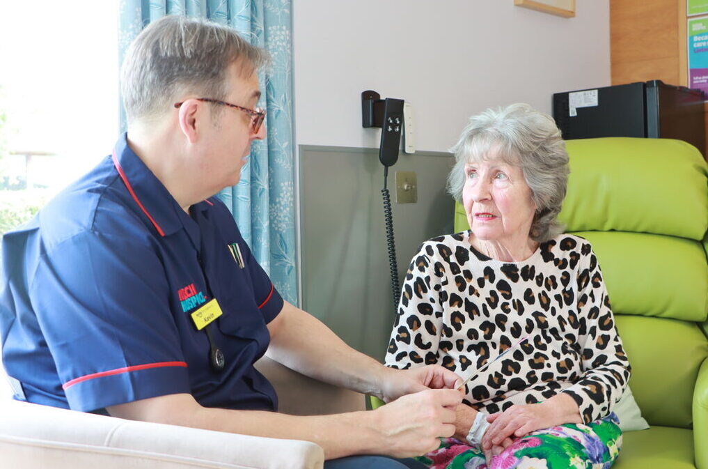 Nurse with adult patient on in patient unit aspect ratio 1017 673