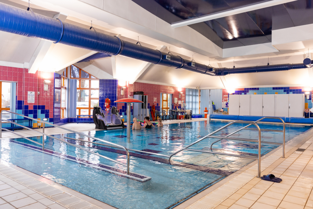 Charlotte Nicklin, Palliative Aquatic Physiotherapist in hydrotherapy pool at Keech Hospice with patients
